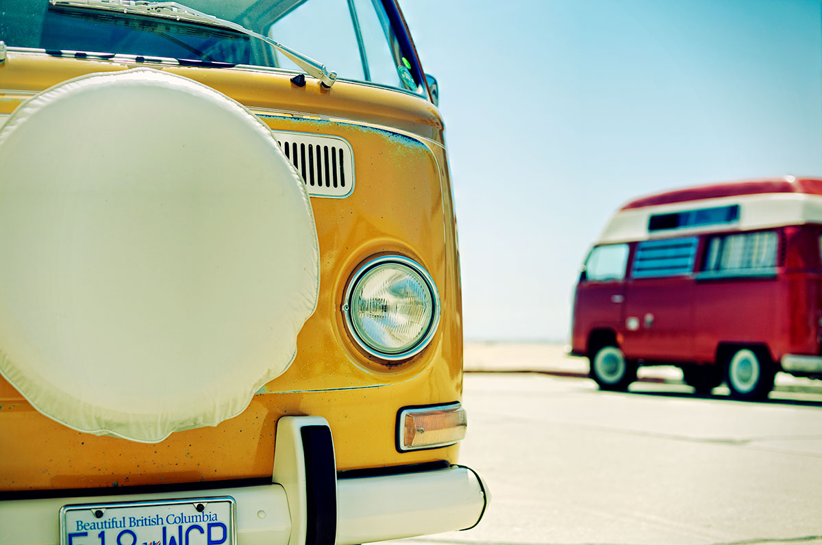 Pair of Volkswagen Buses on the beach in California car photo from Burbbble