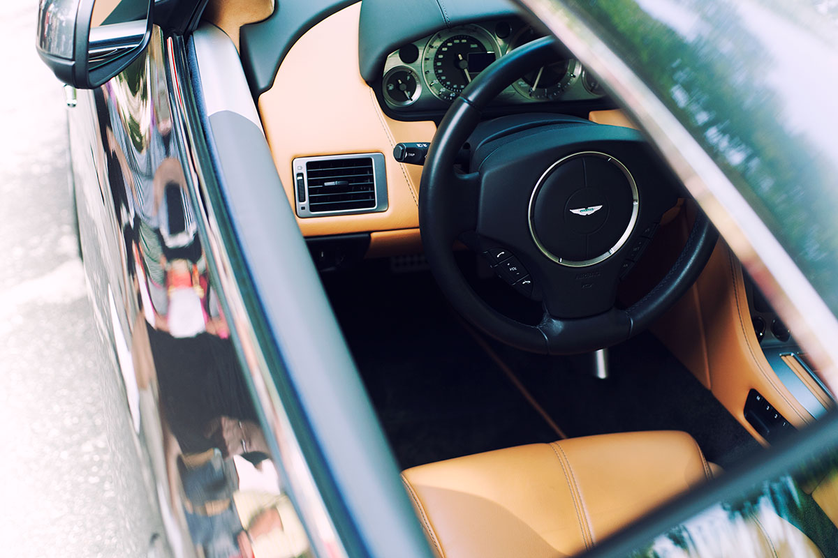Aston Martin DB9 Tan Interior Steering Wheel car photo from Burbbble