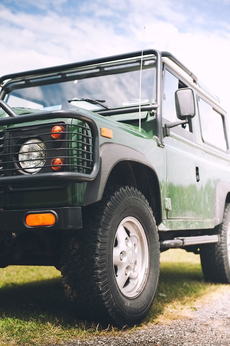 British Racing Green Land Rover Defender car photo from Burbble