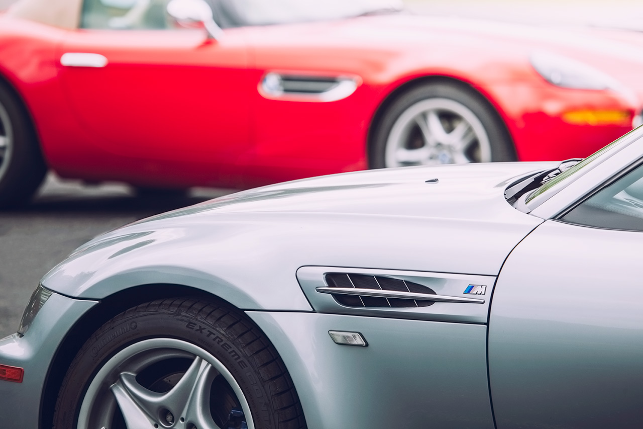Silver BMW Z3 M Coupe and red BMW Z8