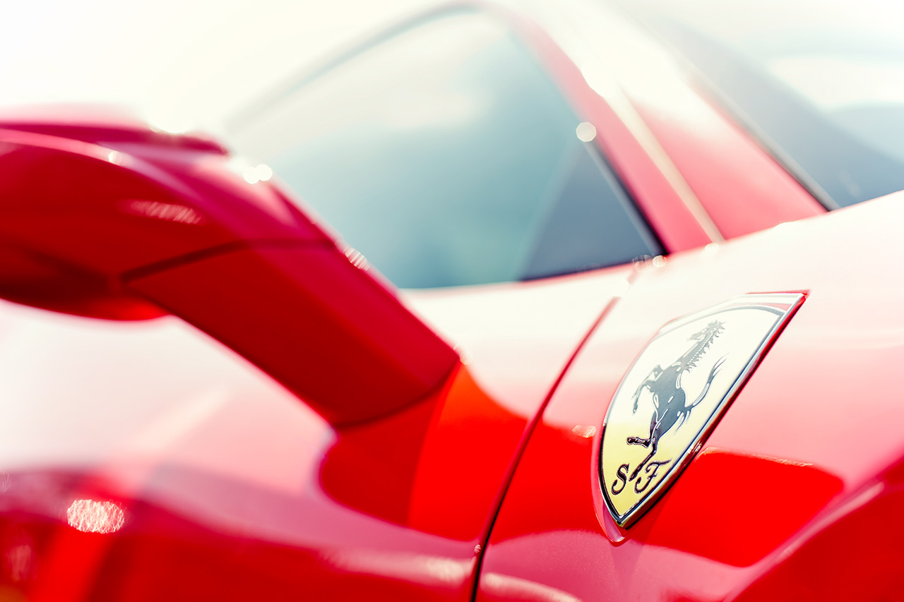 Inspiring close up shot of a rosso corsa Ferrari 458 Italia coupe
